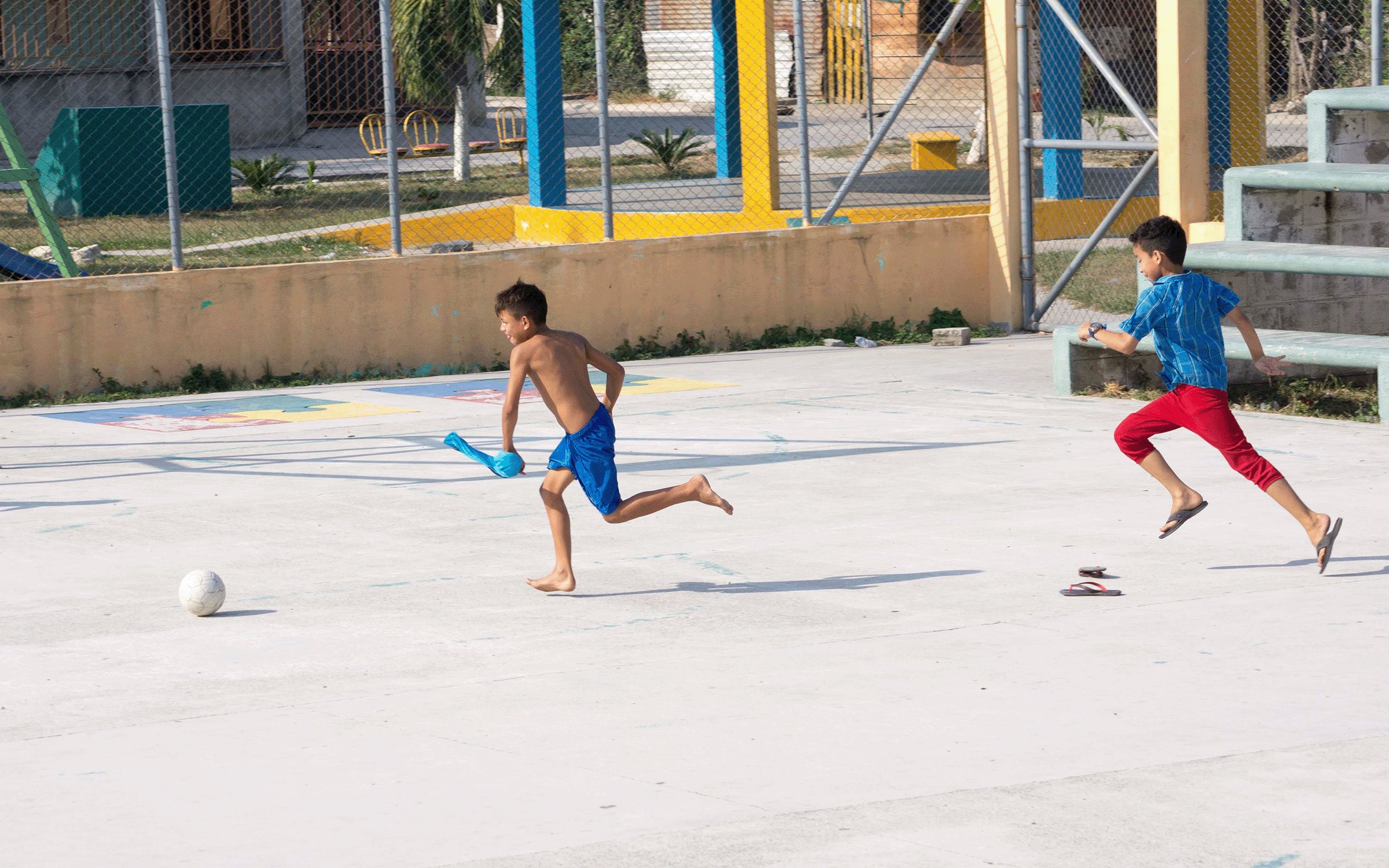 a group of young men playing a game of frisbee