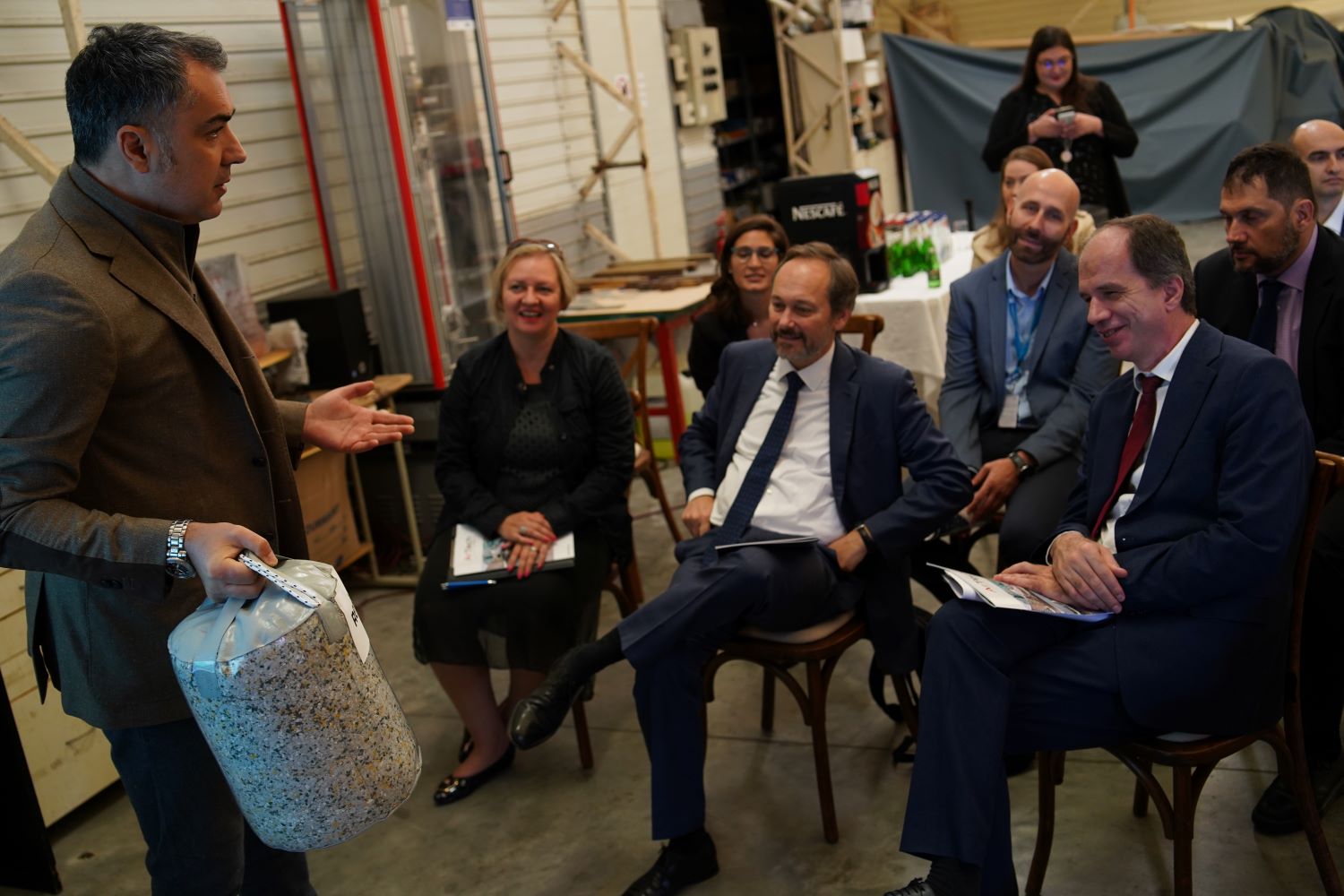 a group of people sitting in chairs