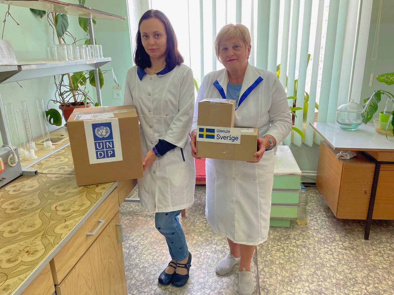 Employees at a State Environmental Inspectorate of Ukraine laboratory receive supplies for monitoring river water quality